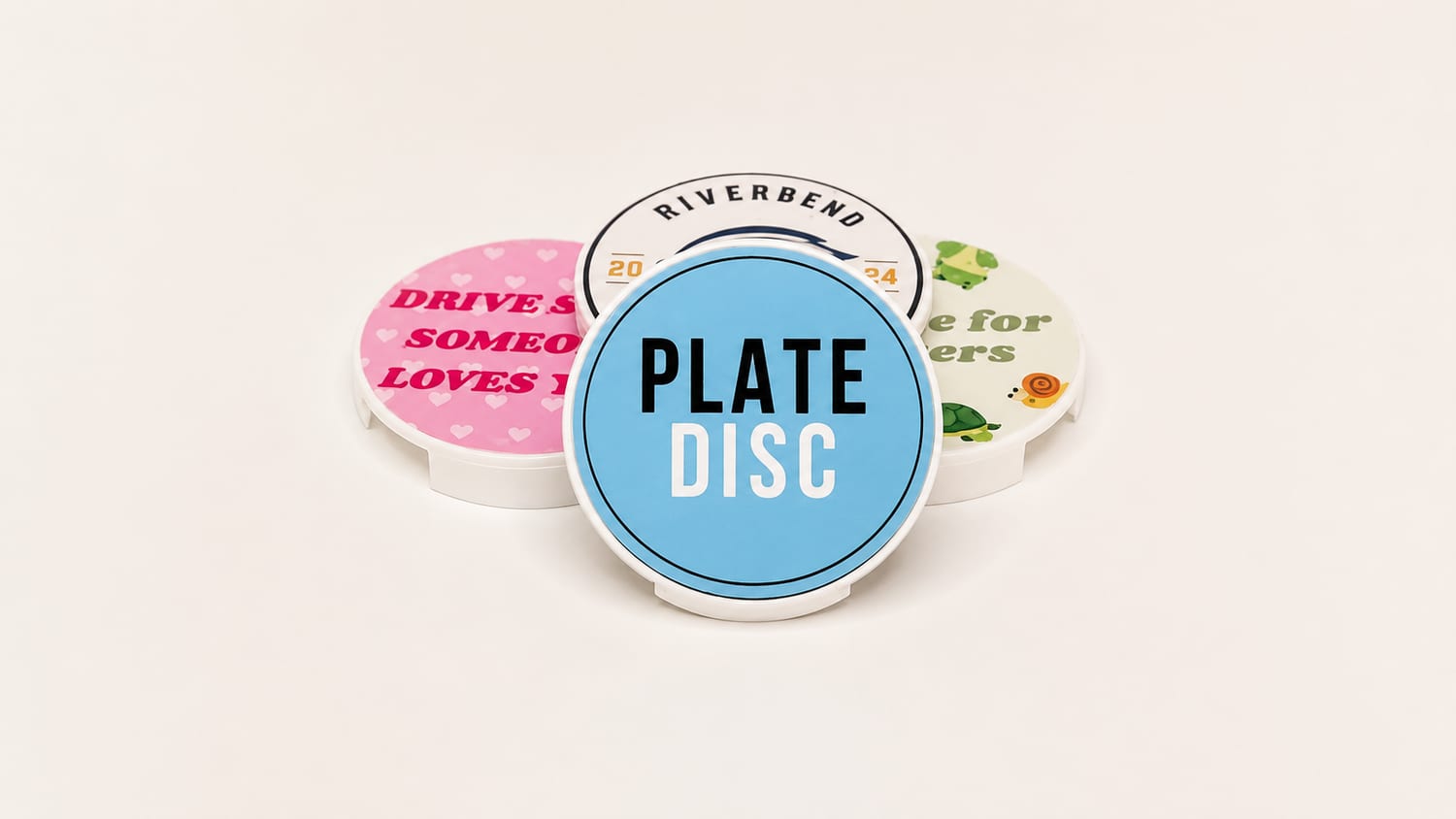 Custom Plate Discs — a team logo, a Drive Safe slogan, a critters design and the Plate Disc logo