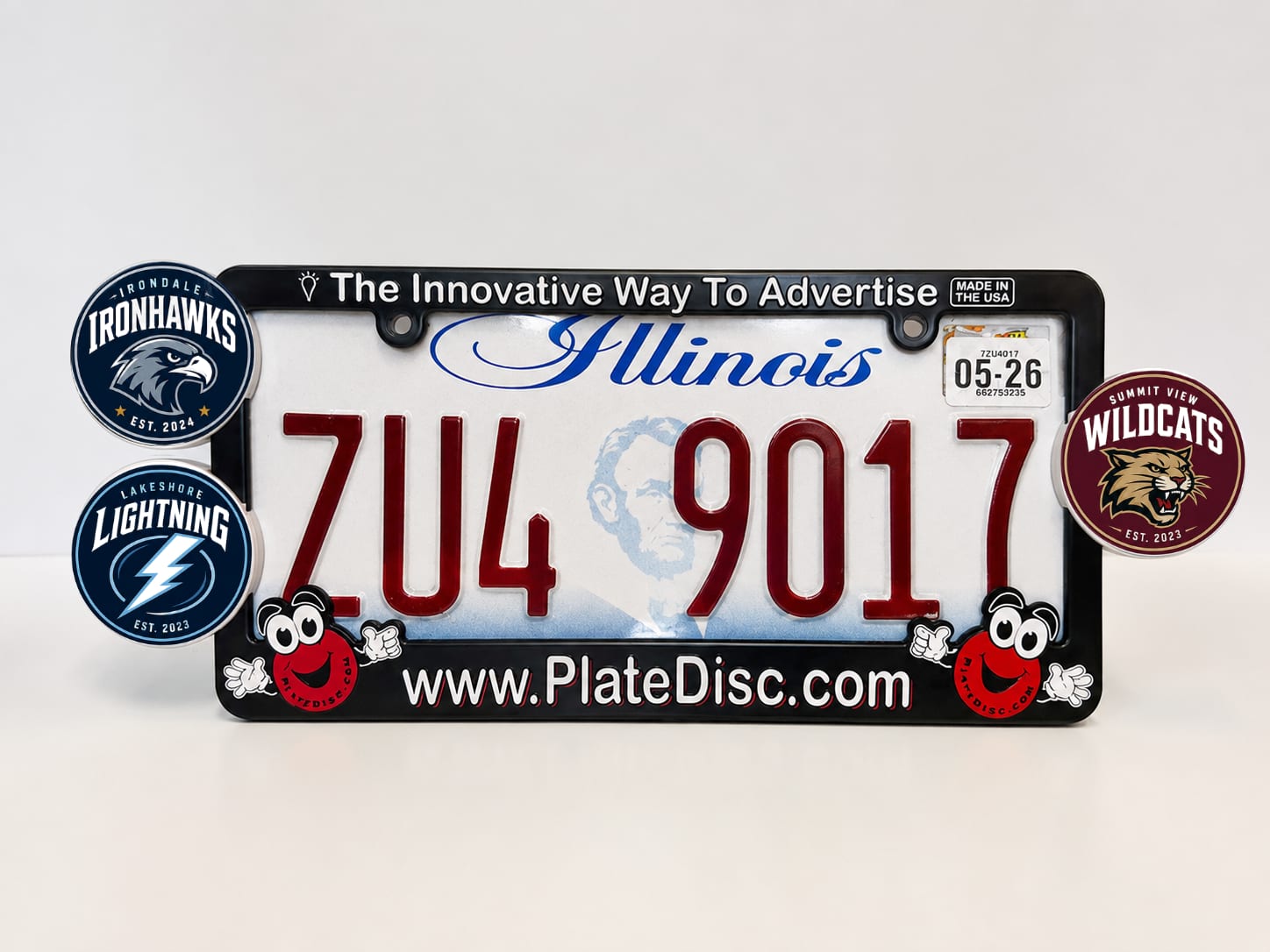 Plate Disc license plate frame with three team Plate Discs clipped onto the side rails